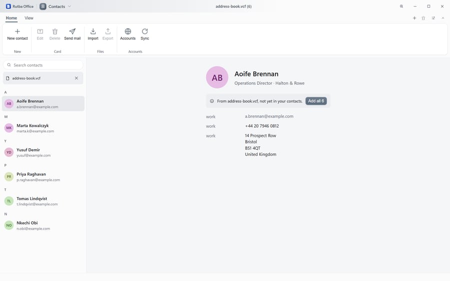 The Contacts app showing an address book grouped by initial with coloured monogram avatars, and a detail pane giving one person’s job title, organisation, work email, telephone number and postal address